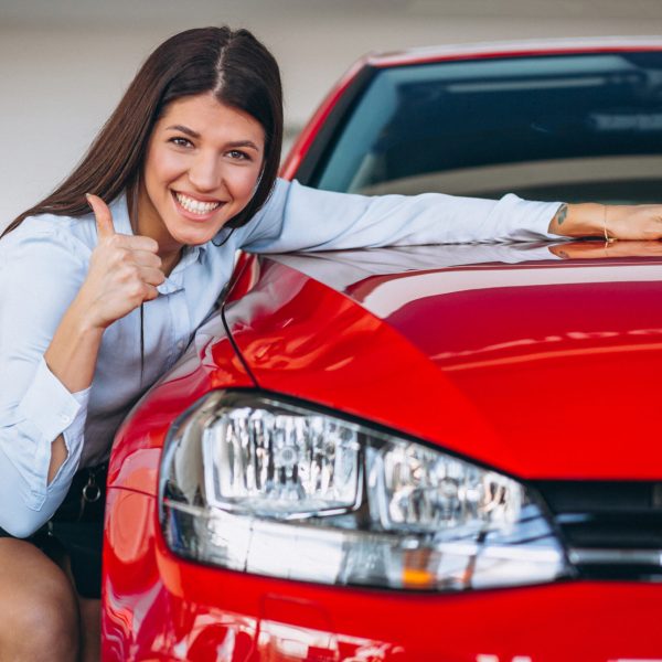 Young woman buying a car